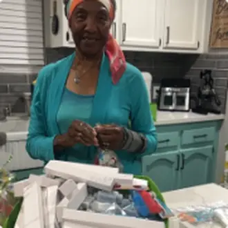 Volunteers packing grocery bags in the kitchen