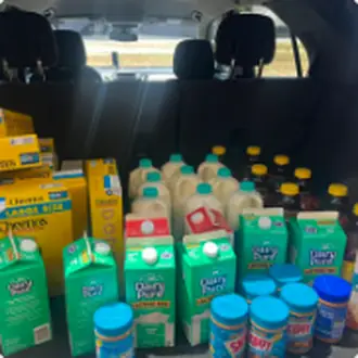A car loaded with groceries ready for delivery